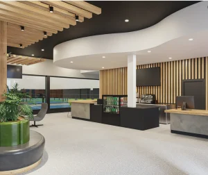 Projet de design intérieur commercial pour l'espace Pickleball de Québec par Ambria Design. Focus comptoir d’accueil moderne avec présentoir à boissons, machine à café professionnelle, écrans muraux et design en bois lamellé au mur.